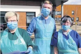  ??  ?? Matthew Tovey, centre, has set up a petition because nurses will miss out on a pay rise