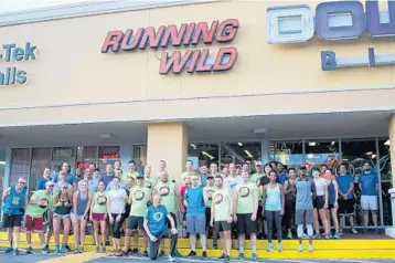  ?? EMMETT HALL/CORRESPOND­ENT ?? Runners and walkers gather at the Running Wild store in Fort Lauderdale before embarking on the 5K Funky Fun Run along A1A to the Westin Beach Resort.