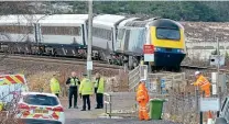  ?? JOHN CUMMINGS ?? HST power car No. 43012 and a trailer vehicle derailed on the up to down crossover at Dalwhinnie.