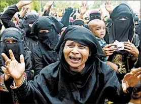  ?? DIBYANGSHU SARKAR/GETTY-AFP ?? Rohingya refugees burst into tears at a protest march Saturday in Ukhia, Bangladesh, after a camp ceremony marking the anniversar­y of a military crackdown in Myanmar.