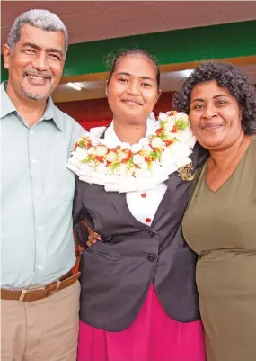  ?? Photo: Leon Lord ?? Adi Cakobau School head girl Kelera Fong with her parents Lima Nakula (left) and Salusalu Ratu in Sawani on May 22, 2022.