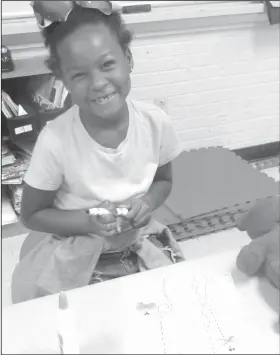  ??  ?? Club days: Club days at Northwest Elementary provide activities to engage students in new and enriching ways. Students meet and gain skills in pursuits that enhance their regular school curriculum. First-grader Deniecea Montgomery creates a garden...