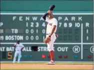  ?? Mary Schwalm / Associated Press ?? Red Sox shortstop Xander Bogaerts wipes his forehead during the sixth inning against the Rays on a hot day on Thursday in Boston.