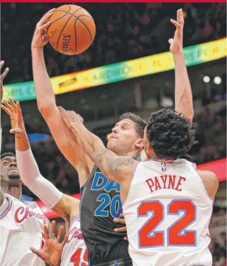  ?? | JONATHAN DANIEL/ GETTY IMAGES ?? The Mavericks’ Doug McDermott is fouled Friday by the Bulls’ Cameron Payne. He scored eight points against his old team.