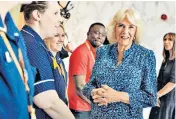  ?? ?? The Queen, patron of Roald Dahl’s Marvellous Children’s Charity, meets nurses on a visit to the Royal London Hospital