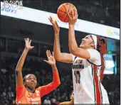  ?? Nell Redmond The Associated Press ?? South Carolina center Kamilla Cardoso lines up a shot over Tennessee forward Jillian Hollingshe­ad in the Gamecocks’ victory Sunday at Colonial Life Arena.