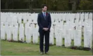  ?? ADRIAN WYLD — THE CANADIAN PRESS VIA THE ASSOCIATED PRESS ?? Canadian Prime Minister Justin Trudeau stands among the military gravestone­s as he visits the Canadian Cemetery No. 2 near Vimy Ridge, France, on Saturday.