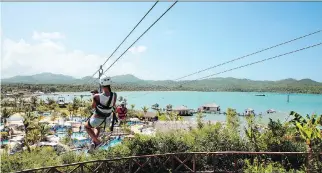  ?? HOLLAND AMERICA LINE ?? A tourist ziplines in Amber Cove, in the Dominican Republic.