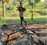  ??  ?? Gus, 7, gathers firewood at Coppergate Ranch. Hipcamp partnered with private landowners.