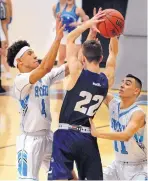 ?? JIM THOMPSON/JOURNAL ?? Cleveland’s Jalen Munn (4) and teammate Isaiah Molina (11) try their best to trap Rio Rancho’s Hunter Pirkle (22) on Saturday.
