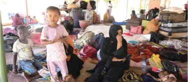  ?? Reuters ?? ↑
Sudanese people rest at a camp centre following the crisis in Khartoum on Sunday.