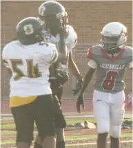  ?? By Danny P. Smith, SDN) (Photo ?? Armstrong 7th grade offensive lineman Ashton Bogard (54) celebrates the deciding touchdown with tight end Micah Myles in Thursday’s 16-8 win over Louisville.