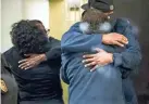  ?? THE INDIANAPOL­IS STAR ?? People hug after learning that their loved ones are safe after a shooting inside a FedEx building Friday.