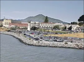  ?? Eric Risberg Associated Press ?? SAN QUENTIN experience­d a coronaviru­s surge after receiving 121 inmates from the state prison in Chino. Some of those inmates hadn’t been recently tested.