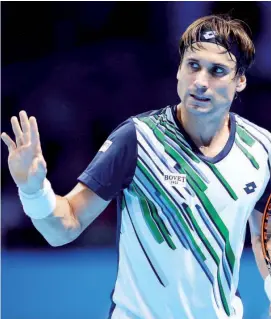  ?? Photo
— AFP ?? Spain’s David Ferrer reacts to a point during his Group B singles match against Japan’s Kei Nishikori on day five of the ATP World Tour Finals tennis tournament in London on November 13, 2014.