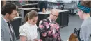  ??  ?? Scott Conant, Marcela Valladolid and Jason Smith check in on Becca Craig in “Best Baker in America”