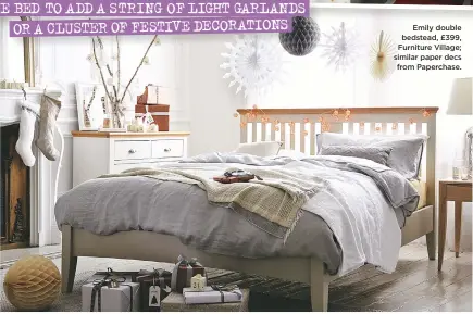  ??  ?? Use your headboard or space above the bed to add a string of light garlands or a cluster of festive decoration­s Emily double bedstead, £399, Furniture Village; similar paper decs from Paperchase.