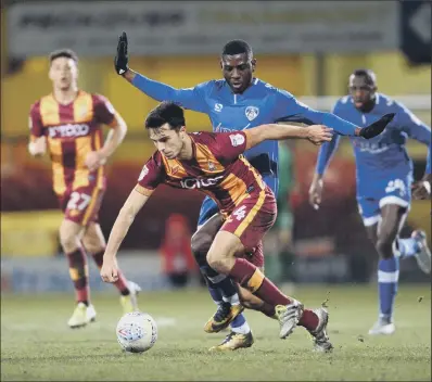  ?? PICTURE: BRUCE ROLLINSON ?? THAT’S MINE: Bradford City’s Daniel Devine moves clear of Oldham Athletic’s Ousmane Fane at Valley Parade last night but it was the visitors who came out on top, winning the Checkatrad­e Trophy Northern Section second round match 1-0.