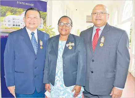  ?? Picture: SUPPLIED ?? Christophe­r Yee (left) with Della Shaw-Elder and Sikeli Tuinamuana after receiving their 50th anniversar­y of Independen­ce commemorat­ive medal during a special investitur­e ceremony at State House on October 8, 2020.