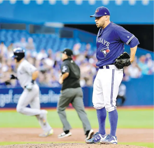  ?? — THE CANADIAN PRESS ?? Toronto Blue Jays starting pitcher Marco Estrada watched Tampa Bay’s Taylor Feathersto­n round the bases on a solo home run in the third inning in Toronto on Tuesday, then watched Logan Morrison do the same thing on a three-run shot in the same inning.