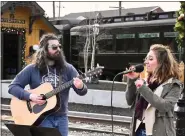  ?? ?? Justin Fava and Stephanie Grace perform Country Pop music at the Rail Yard during the Beary Loved: A Valentine’s Stroll Through Boyertown event Feb. 12.