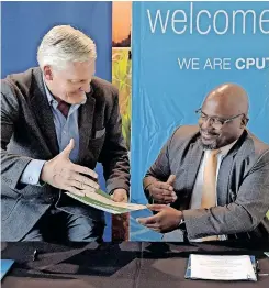  ?? | PHANDO JIKELO African News Agency (ANA) ?? CPUT through its SA Renewable Energy Technology Centre signed a memorandum of agreement with Eskom. Pictured are Eskom CEO André De Ruyter and CPUT vice-chancellor Chris Nhlapho.