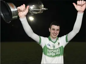  ??  ?? Kanturk captain Dan O’Donoughue thrilled to receive the Duhallow U-21 Hurling Championsh­ip Cup following a victory over Dromtariff­e