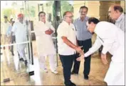  ?? HT PHOTO ?? A party worker touches Ashok Parnami’s feet on Saturday.