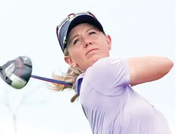  ?? — AFP photo ?? American Amy Olson had a two-stroke lead after the second round of the HSBC Women's World Championsh­ip at Sentosa Golf Club in Singapore.