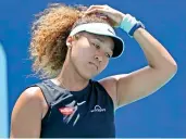  ??  ?? Naomi Osaka reacts to losing a point in this file photo.