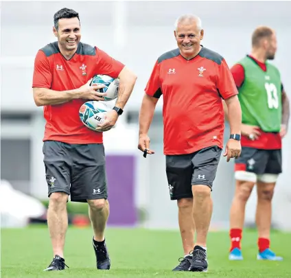  ??  ?? Fitting right in: Stephen Jones (left) believes his familiarit­y with the players and Warren Gatland’s management team has helped