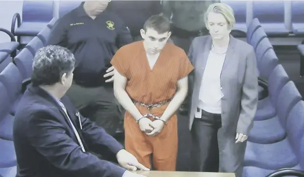  ?? GETTY ?? High school shooting suspect Nikolas Cruz appears in court with his lawyer Melisa Mcneill in Fort Lauderdale, Florida