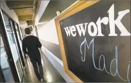  ?? Mark Lennihan Associated Press ?? WEWORK appears to be executing on some of the SoftBank chief executive’s plans for a turnaround. Above, a WeWork office space in New York this week.