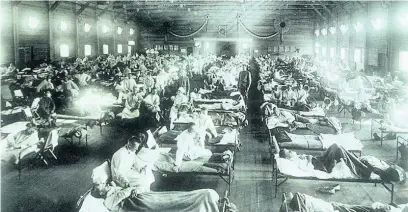  ??  ?? People in a makeshift hospital being treated for Spanish influenza