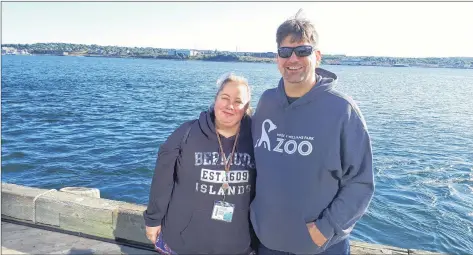  ?? CP PHOTO ?? Christi Legare and her husband, Daniel, pose on the Halifax waterfront on Sunday. Cruise ship passengers who planned on a warm-weather vacation but ended up in Atlantic Canada instead say they’re disappoint­ed about the last-minute change in plans, but they understand the need to put safety first.