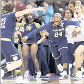  ?? TONY DEJAK — THE ASSOCIATED PRESS ?? Notre Dame’s Arike Ogunbowale (24) is congratula­ted by Jessica Shepard (23) after sinking a 3-pointer to defeat Mississipp­i State 61-58 in Sunday’s title game.
