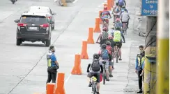  ?? —NIÑO JESUS ORBETA ?? EXCLUSIVE LANE Cyclists try out the bike lane on Edsa, which formally opened on Saturday. Composed of six sections, it stretches from Edsa Aurora to Magallanes southbound.