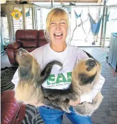  ?? JOE BURBANK/ORLANDO SENTINEL ?? Owner Leslie Rush holds two of her sloths during the Simply Sloths tour at the Exotic Animal Experience in east Orlando.