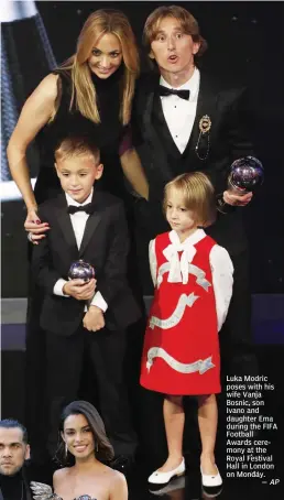  ?? AP ?? Luka Modric poses with his wife Vanja Bosnic, son Ivano and daughter Ema during the FIFA Football Awards ceremony at the Royal Festival Hall in London on Monday. —