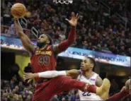  ?? TONY DEJAK — THE ASSOCIATED PRESS ?? The Cavaliers’ Jae Crowder and the 76ers’ Richaun Holmes vie for a rebound during the first half.