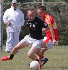  ??  ?? Adam Beary (St. Joseph’s) beat Horeswood’s David Larkin to the ball.