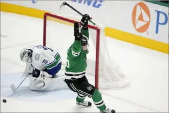  ?? (AP PHOTO/ TONY GUTIERREZ) ?? Dallas Stars center Matt Duchene celebrates scoring the winning goal against Vancouver Canucks goaltender Thatcher Demko (35) in final seconds of overtime Thursday.