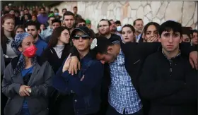  ?? (AP/Oded Balilty) ?? People mourn Monday at the funeral for Eliyahu Kay, a 26-year-old Israeli who was killed Sunday by a Palestinia­n gunman in the Old City of Jerusalem.