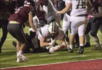  ?? JEN FORBUS — FOR THE MORNING JOURNAL ?? Elyria Catholic’s Leighton Banjoff leaps into the end zone for a Panther touchdown against Genoa Area in a Division V, Region 18semifina­l on Nov. 10.