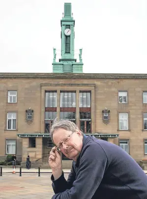  ?? Picture: Tina Norris. ?? George Proudfoot in front of the spire-less landmark.