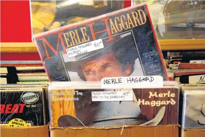  ??  ?? Merle Haggard records are shown Wednesday at Trolley Stop Record Shop, 1807 N Classen, in Oklahoma City. The country music legend, whose parents were from Checotah, died Wednesday on his 79th birthday at his home in North Carolina.