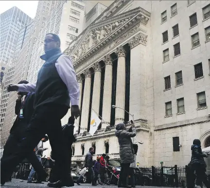  ?? SPENCER PLATT/GETTY IMAGES ?? The U.S. S&P 500 financial sector posted its biggest daily plunge in about nine months due to what analysts say is reduced confidence that U.S. President Donald Trump’s pro-growth policies would occur soon, and concerns about a dovish Federal Reserve.