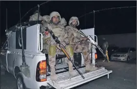  ?? AP/ARSHAD BUTT ?? Pakistani troops arrive early Tuesday at a police training school in Quetta after militants stormed the school in a bloody assault. The militants died in clashes with Pakistani forces.