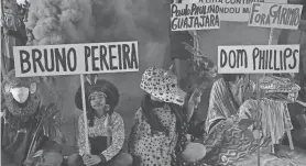  ?? NELSON ALMEIDA/AFP VIA GETTY IMAGES ?? Guarani Indigenous people and environmen­tal activists protest in Sao Paulo about the murder of British journalist Dom Phillips and Indigenous expert Bruno Pereira.