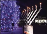  ?? Christian Abraham / Hearst Connecticu­t Media ?? The Chabad Jewish Center of Milford-Hebrew Congregati­on of Woodmont holds its Menorah Lighting on the Milford Green in Milford in 2019.